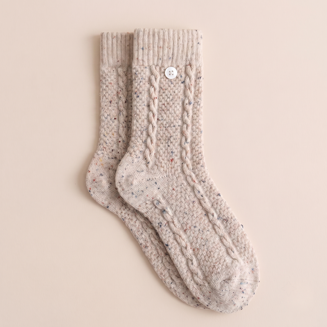 Oatmeal cable-knit heavyweight wool boot socks flat lay