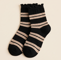 Ankle boot socks in black with cream stripes, featuring a ruffle-trim cuff. Shown as a flat-lay pair on a light backdrop.