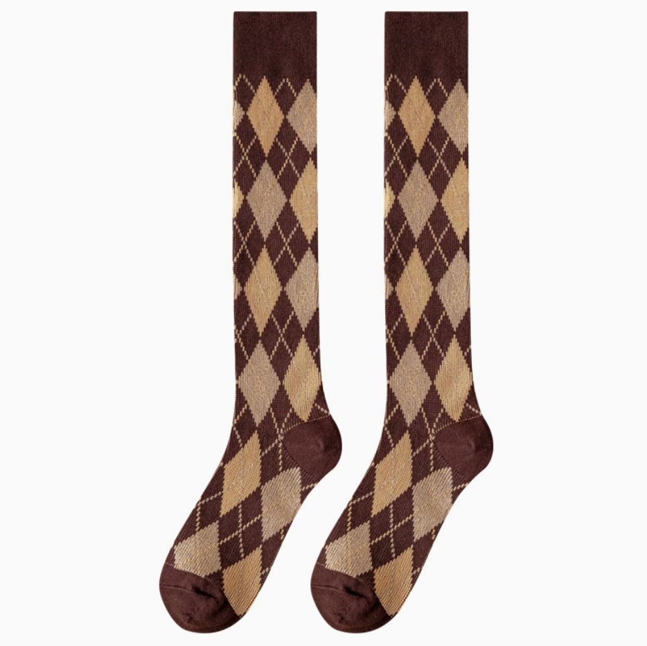 Argyle knee high socks in cream and brown argyle, featuring a classic diamond motif. Displayed flat as a pair on a light backdrop.