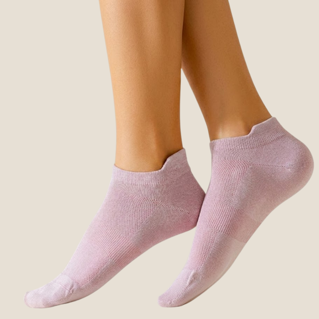 Bamboo ankle socks in pale lilac, featuring a soft breathable knit. Worn on feet in a warm studio setting.