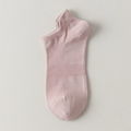 Bamboo ankle socks in soft pink, featuring a smooth bamboo-blend knit. Shown as a single flat-lay on a light backdrop.