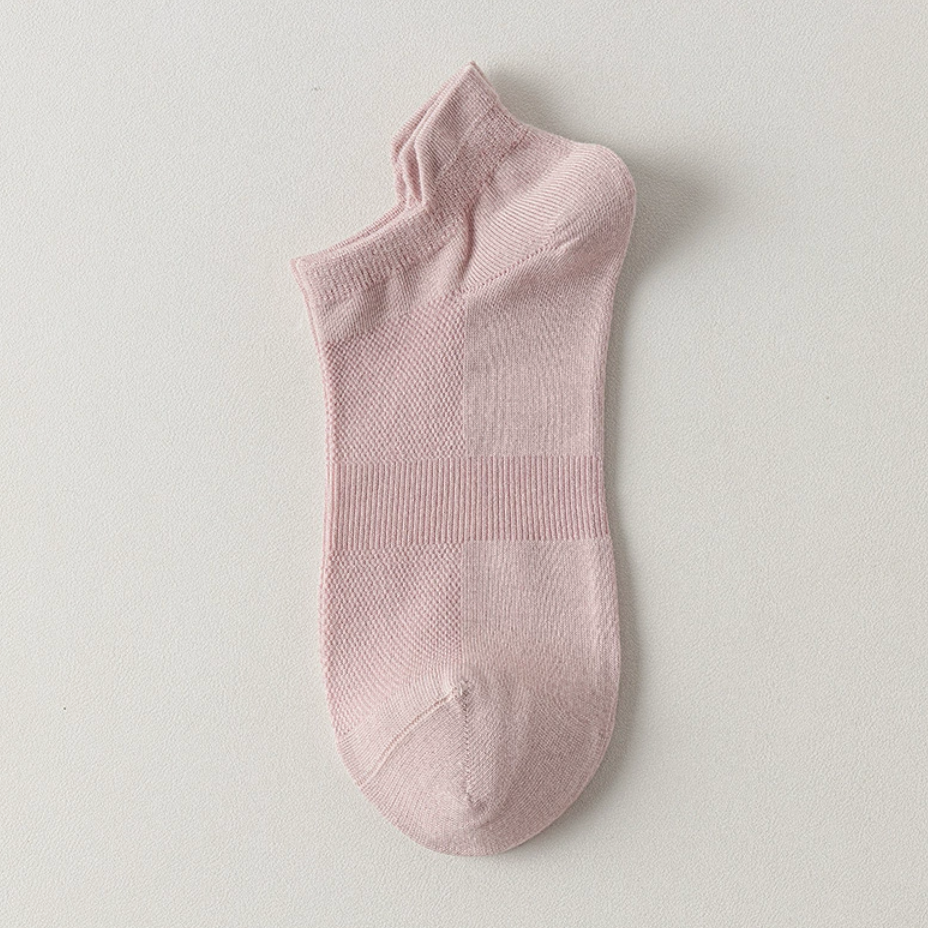 Bamboo ankle socks in soft pink, featuring a smooth bamboo-blend knit. Shown as a single flat-lay on a light backdrop.