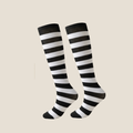 Black and white striped knee socks in bold horizontal stripes, featuring a ribbed knit. Shown as an upright flat-lay pair.