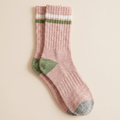 Boot socks for women in pink marled knit, featuring a green stripe and heel accent. Shown as a single flat-lay on a neutral backdrop.
