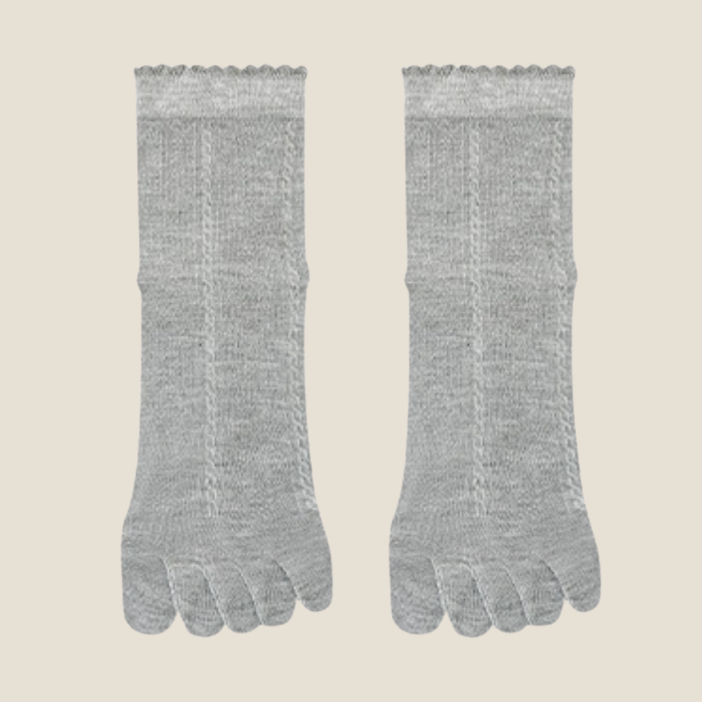 Breathable toe socks in light grey ribbed knit, featuring a soft airy weave. Displayed flat as a pair on a neutral surface.