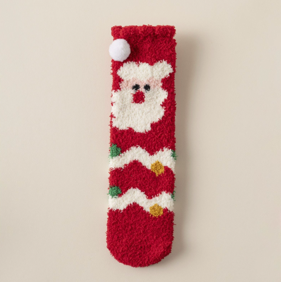 Bulk Christmas socks, a single red plush pair with a Santa and pompom design from the set.