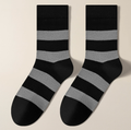 Casual crew socks in black and grey wide stripes, featuring a ribbed knit. Shown as a flat-lay pair on a neutral backdrop.