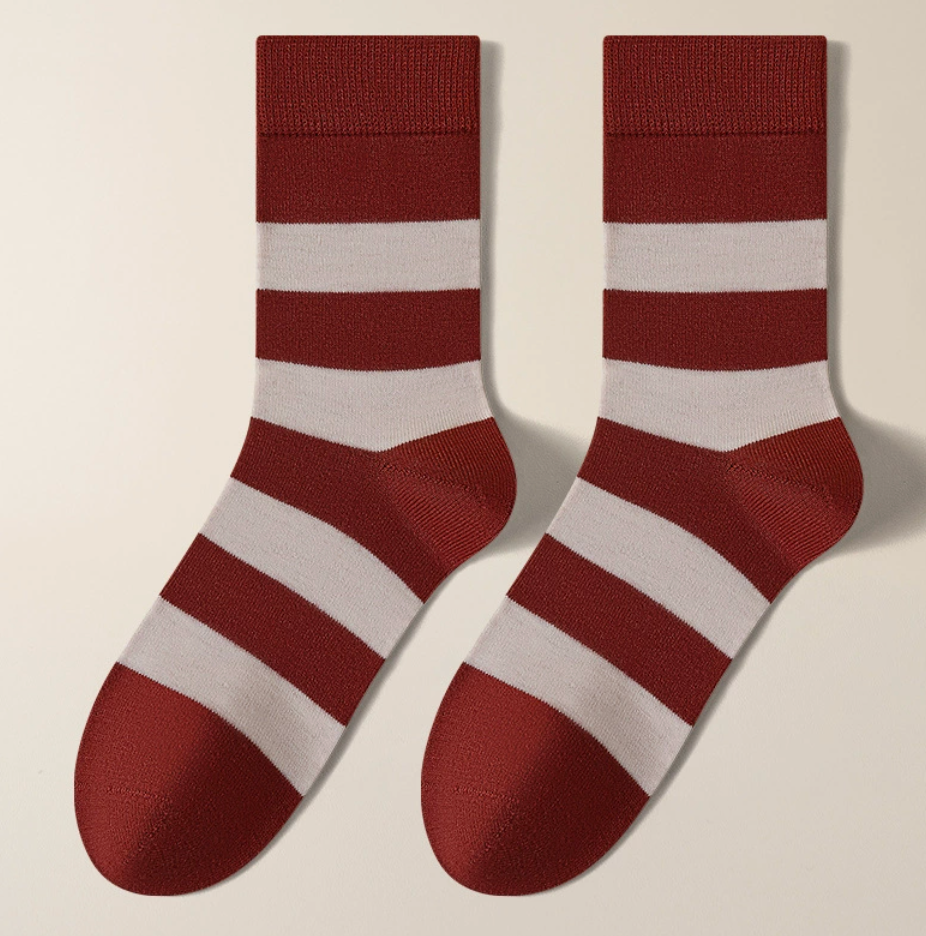 Casual crew socks in burgundy and cream wide stripes, featuring a soft crew length. Displayed flat as a pair on a light surface.