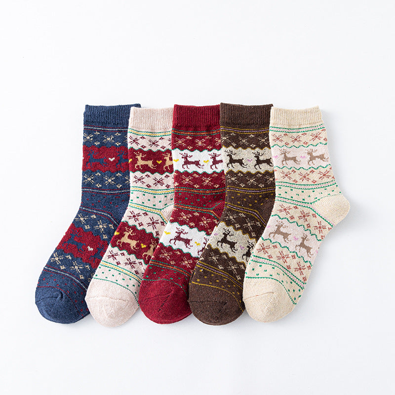 Christmas socks bulk pack, five assorted navy and cream Fair Isle pairs shown fanned out.