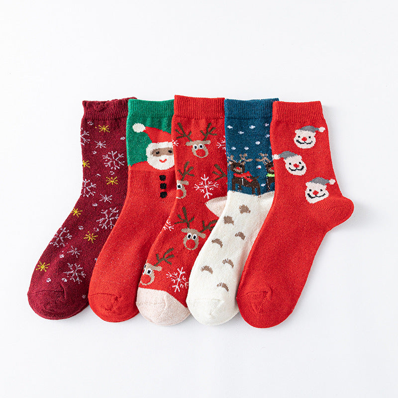 Christmas socks bulk pack, five assorted red-toned holiday pairs fanned out in a flat-lay.