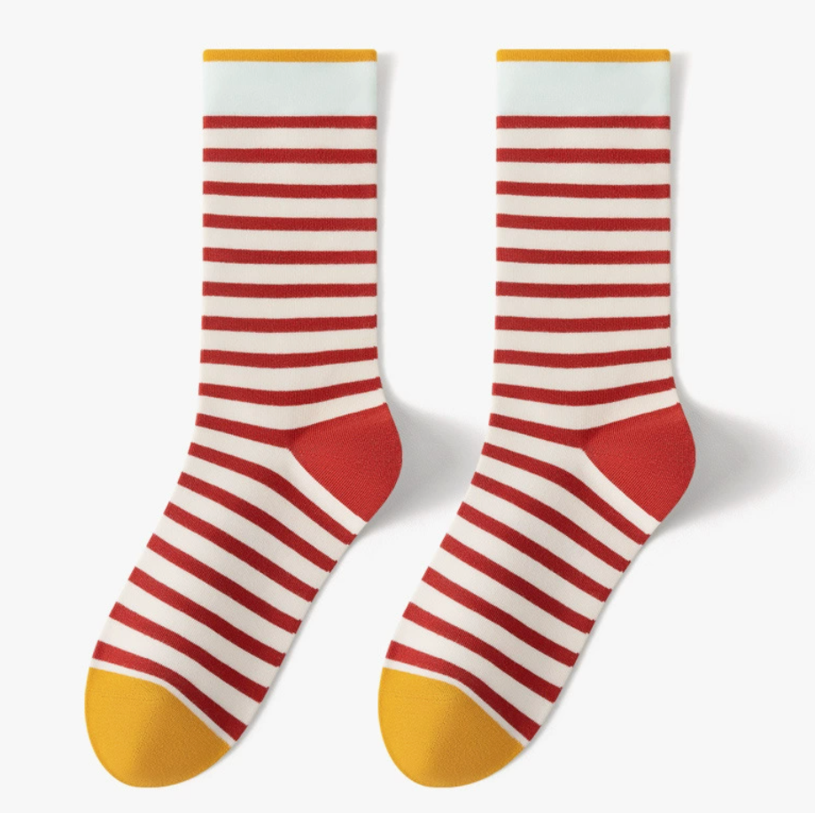 Comfortable crew socks in red and white stripes with mustard cuff and toe, featuring a soft knit. Displayed flat as a pair.