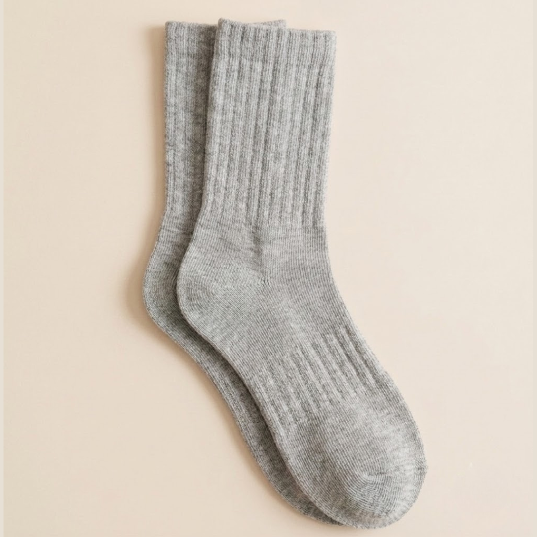 Cotton crew socks in grey ribbed cotton, featuring a classic crew length. Shown as a single flat-lay on a neutral backdrop.
