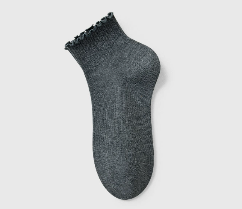 Cotton ruffle socks in dark gray, single ankle sock laid flat with a ruffle cuff.