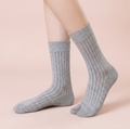 Cotton tabi socks in grey, featuring a ribbed split-toe knit. Worn on feet to show the divided toe.