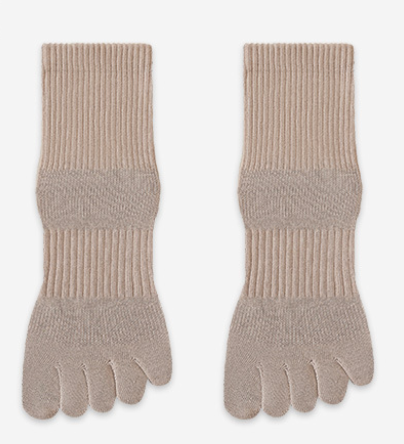 Cotton toe socks in tan ribbed knit, featuring individual toe pockets. Shown as a flat-lay pair on a light surface.
