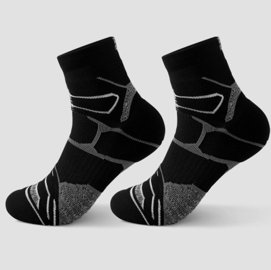 Cushion crew socks in black with grey cushioning, featuring targeted support. Displayed flat as a pair on a light surface.