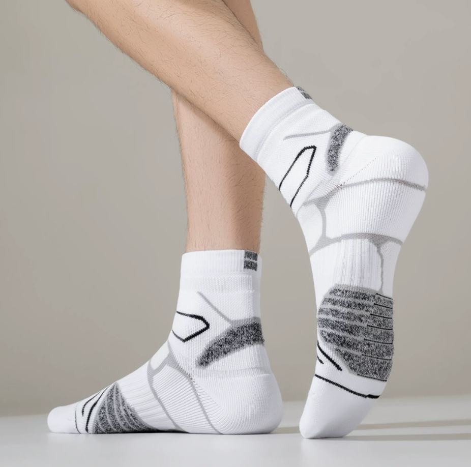 Cushion crew socks in white knit, featuring thick cushioned support. Worn on the feet in an athletic look.