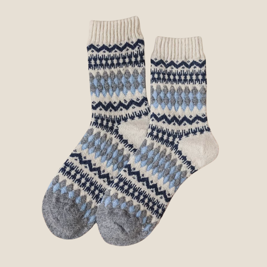 Cute fair isle socks in navy blue Nordic Fair Isle knit, flat-lay pair.