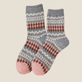 Cute fair isle socks in pink and gray Fair Isle pattern, flat-lay pair.