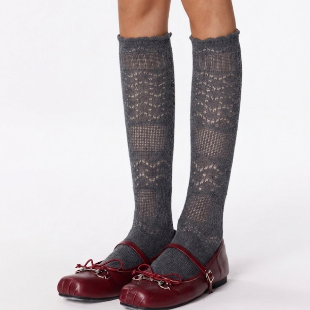 Cute knee high stockings in gray pointelle knit, worn with burgundy Mary Jane shoes, styled on the legs.