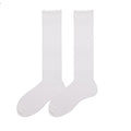 Cute knee high stockings in white pointelle knit, flat-lay pair showing the openwork pattern.