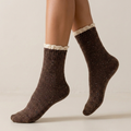 Cute lace socks in espresso brown marled knit with a lace ruffle trim, worn on the feet.