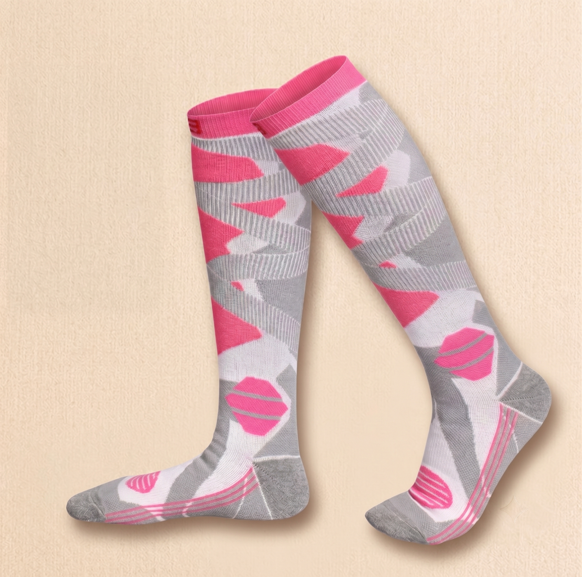 Equestrian boot socks in pink and grey, featuring a heart camo print. Worn on legs to show the tall knee-high fit.