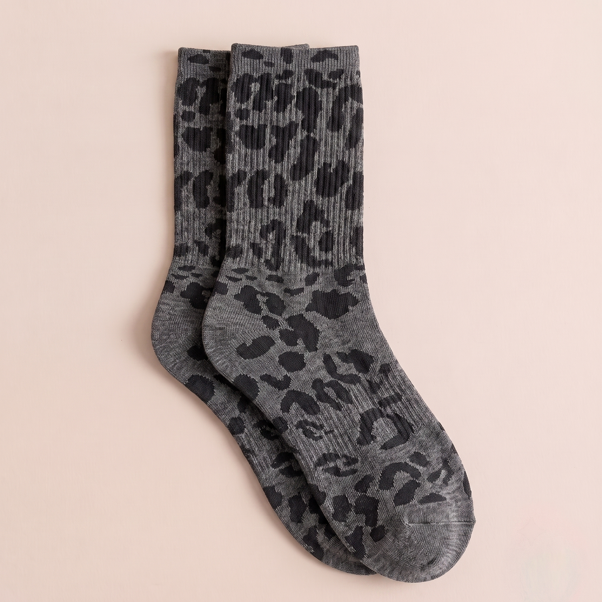 Fashion boot socks in charcoal grey, featuring a leopard-print pattern. Displayed flat as a pair on a light backdrop.