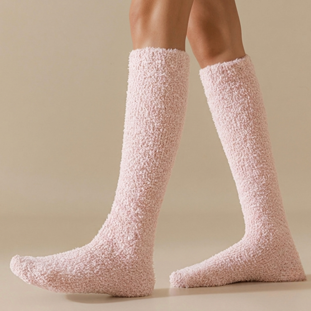 Fleece knee high socks in pink plush fleece, worn over the calf, side view.