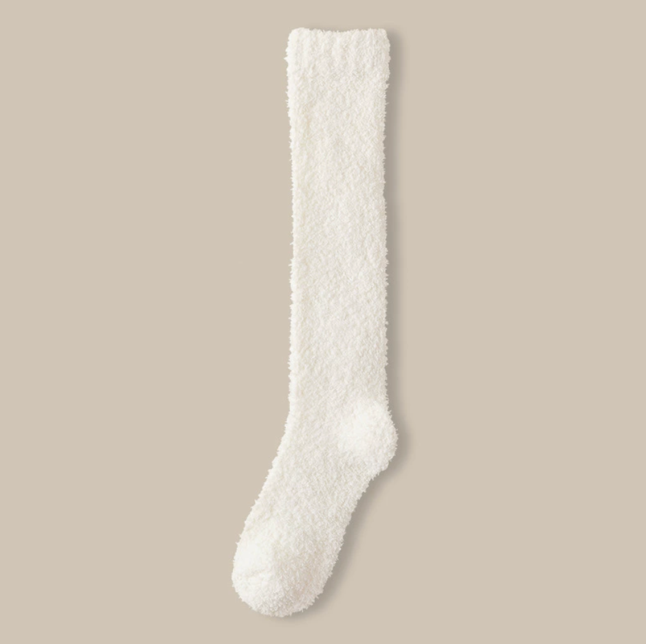 Fleece knee high socks in white plush fleece, a single knee-high sock laid flat.