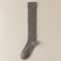 Gray knee socks for women in heather grey cable knit, featuring a textured weave. Shown as a single flat-lay on a neutral backdrop.