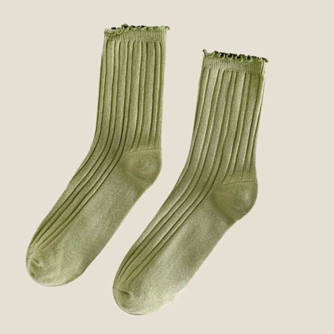 Green ruffle socks in olive green ribbed knit, flat-lay pair with a ruffle cuff.