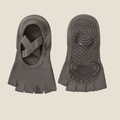 Half toe socks in charcoal grey, featuring a cross-strap top and non-slip grip sole. Shown as a pair to display the pilates design.