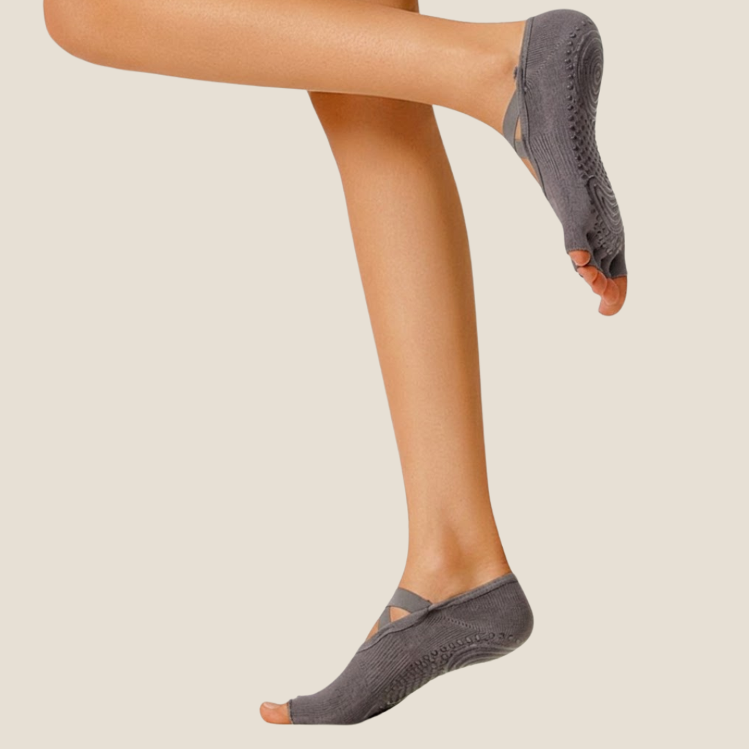 Half toe socks in dark grey knit, featuring an open-toe half-foot design. Worn on crossed legs in a relaxed pose.