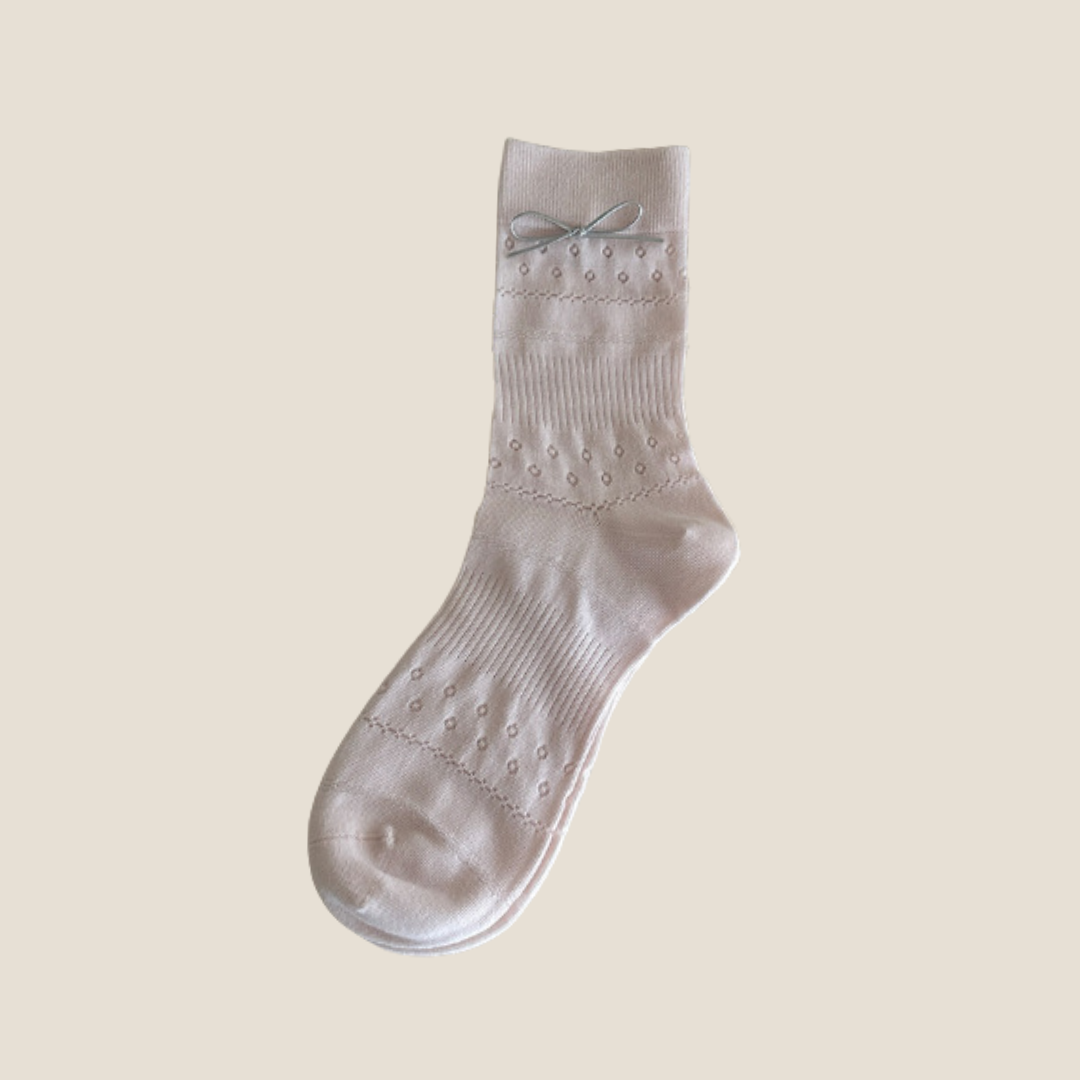 Kawaii socks for women in light blue-gray, close-up of a single sock showing the bow and mesh knit.