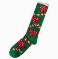 Knee high Christmas socks in green plush fleece with red accents, single sock shown on a foot form.