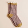 Lace boot socks in mauve pink, featuring a mustard heel and a delicate lace cuff. Displayed flat on a neutral surface.
