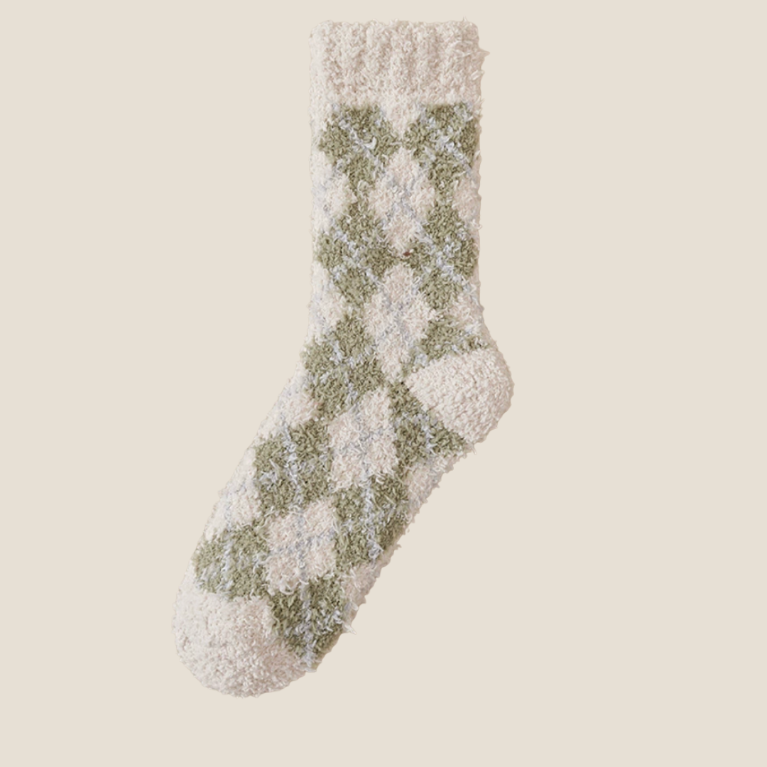 Men's bed socks in sage green plush, featuring a tonal argyle diamond motif. Shown as a single flat-lay on a neutral background.