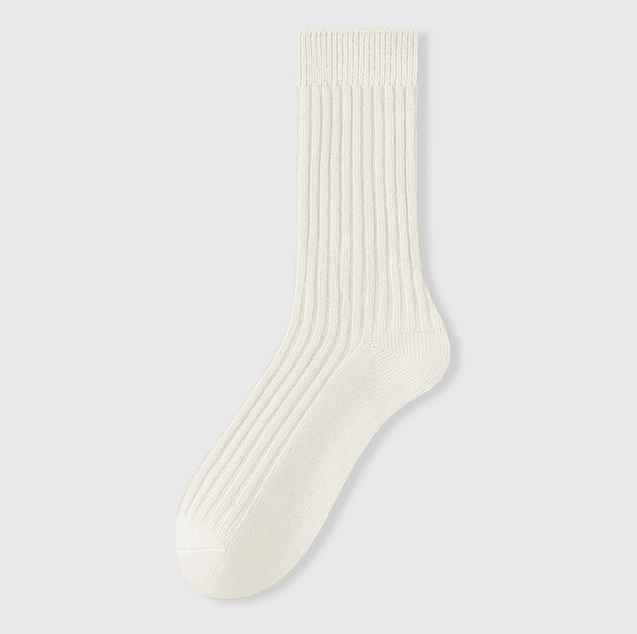 Men's sleep socks in ivory ribbed knit, featuring a lightly cushioned body. Shown standing upright on a neutral surface.