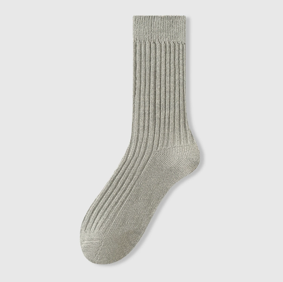Men's sleep socks in sage grey-green, featuring a ribbed breathable weave. Displayed flat to highlight the soft cotton.