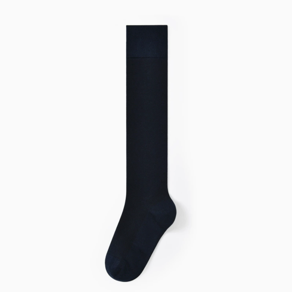 Men's knee socks in navy blue ribbed cotton, featuring a smooth knee-high leg. Displayed flat on a neutral backdrop.