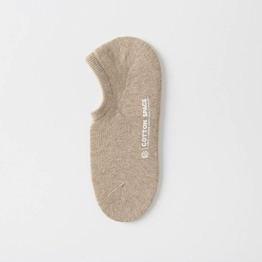 Men's no show socks in beige, featuring a soft low-cut knit. Shown as a single flat-lay on a neutral surface.