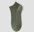 Men's thin ankle socks in olive green, featuring a thin breathable weave. Shown as a single flat-lay on a light backdrop.