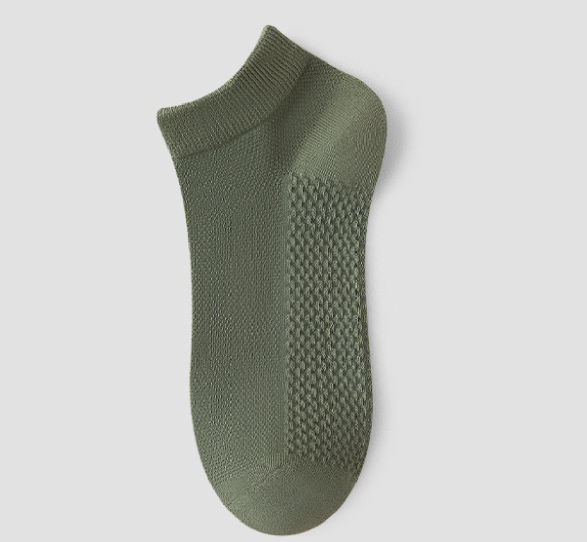 Men's thin ankle socks in olive green, featuring a thin breathable weave. Shown as a single flat-lay on a light backdrop.
