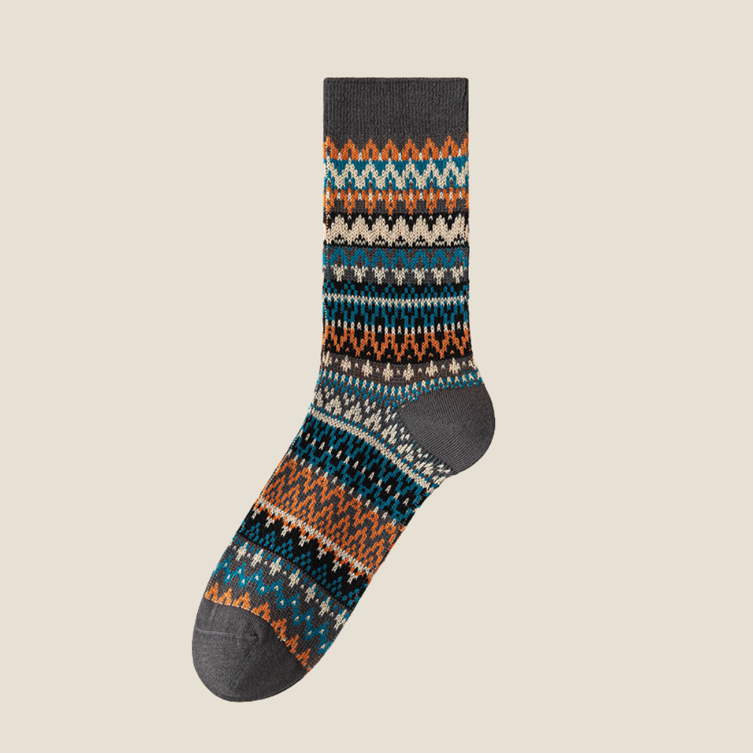 Men's vintage socks in charcoal gray Fair Isle knit, single sock laid flat.