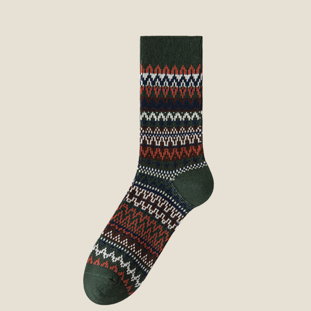 Men's vintage socks in dark green Fair Isle knit, single sock shown flat.