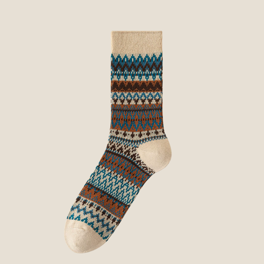 Men's vintage socks in cream ivory Fair Isle with teal accents, single sock shown flat.
