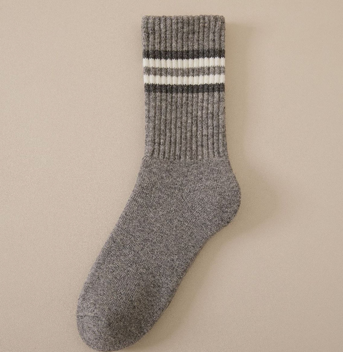 Merino wool thermal socks in heathered gray with cream stripes, a single sock shown flat.