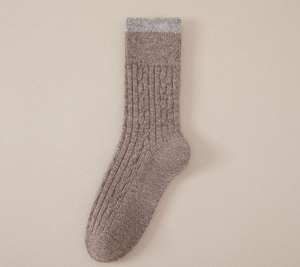 Merino wool warm socks in grey marled wool, featuring a soft cable-knit body. Shown flat on a neutral surface.