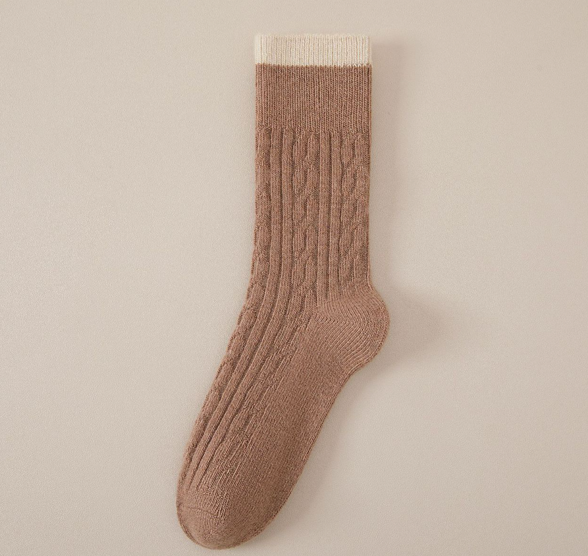 Merino wool warm socks in tan brown, featuring a cream ribbed cuff. Displayed flat to highlight the warm wool blend.